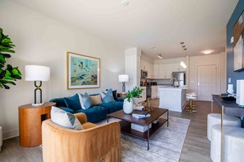 A living room with a couch and a table